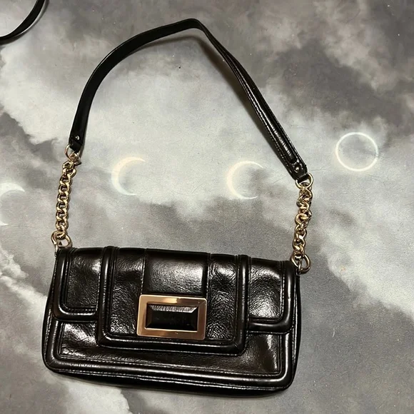 Sleek black faux leather Banana Republic purse with gold accents. - Picture 1 of 4